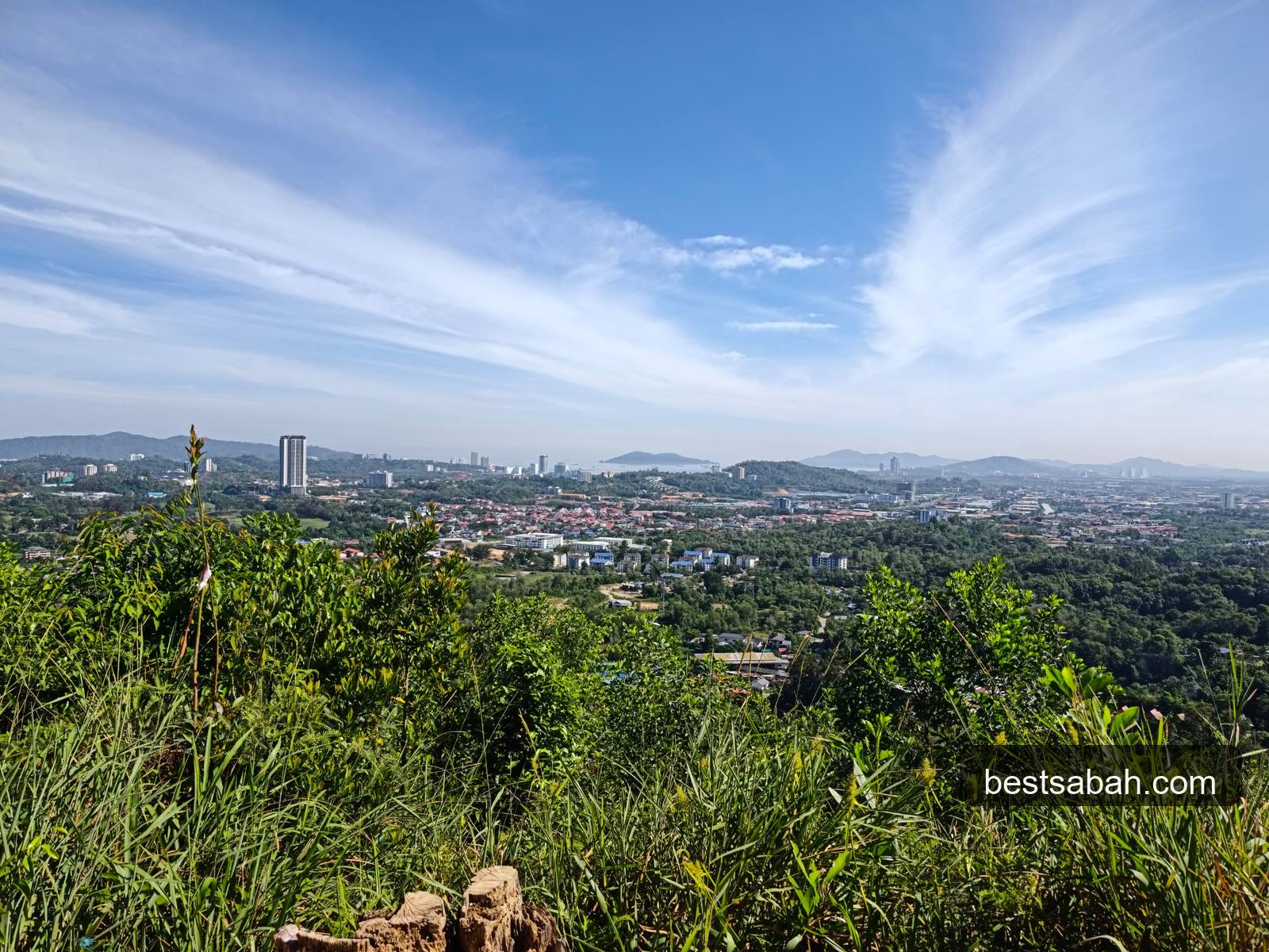 Panoramic view of Kota Kinabalu city and the South China Sea from the summit of Bukit Padang