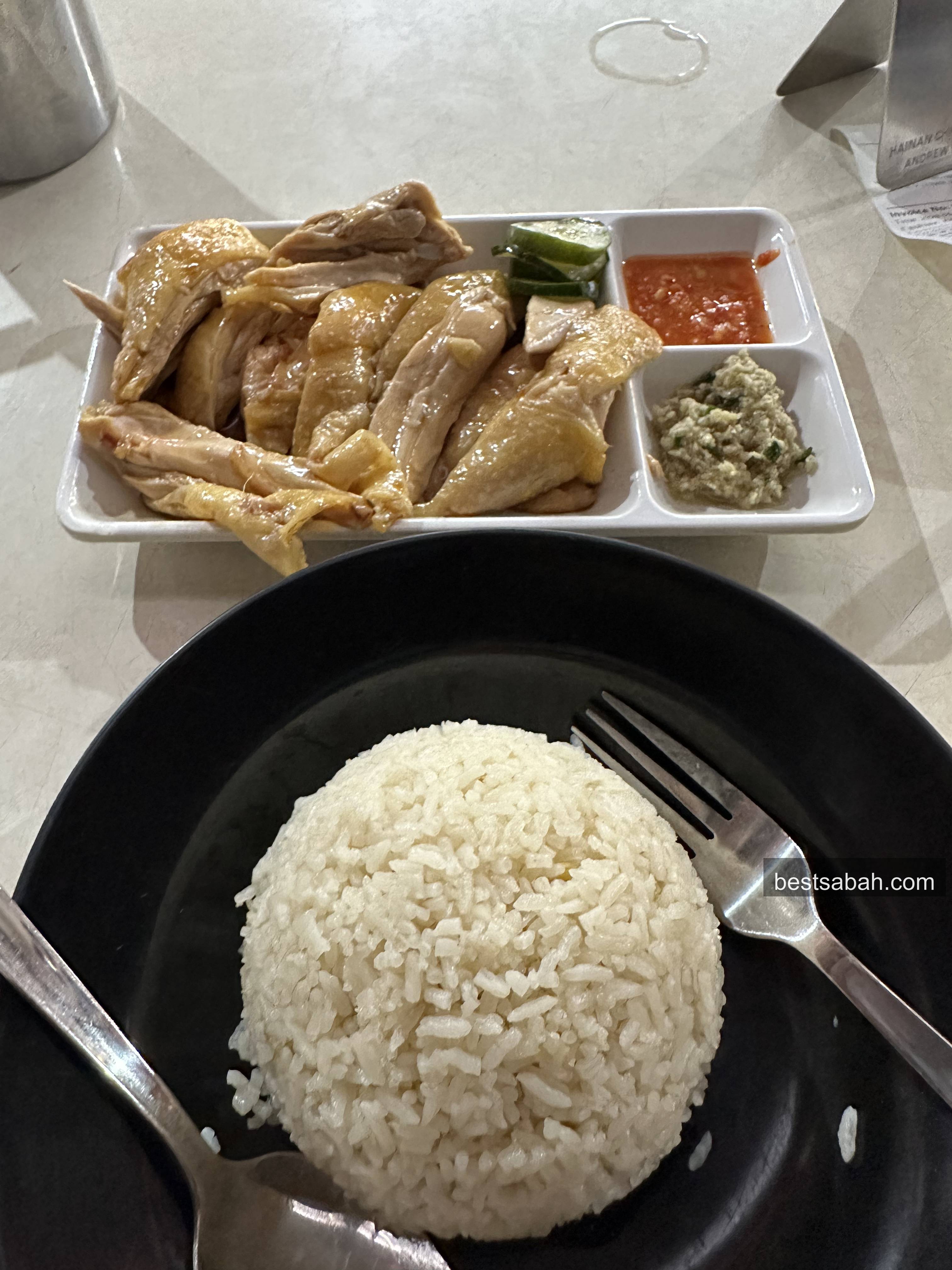 Full plate of Andrew Wong chicken rice with rice, soup and sauces at Damai Plaza KK