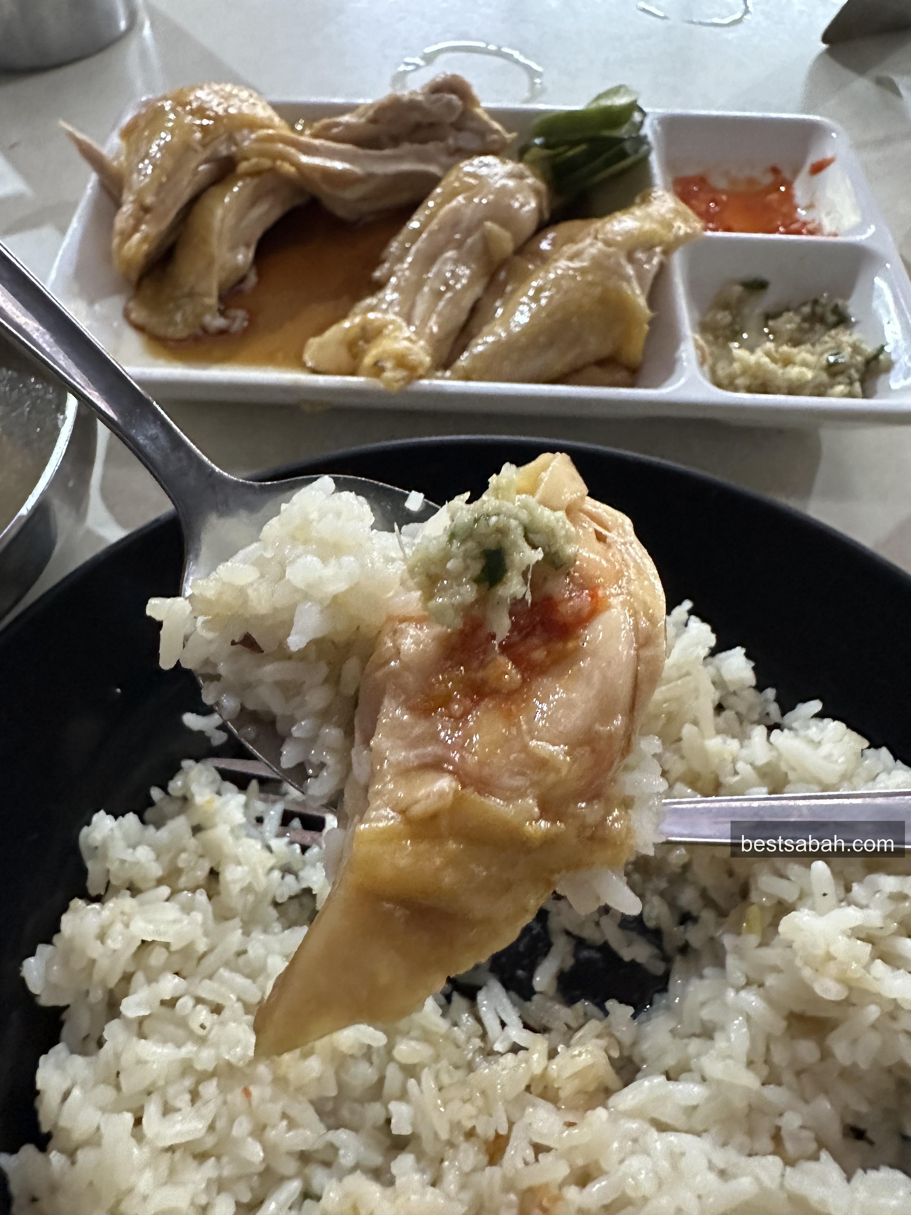 Perfect bite of Andrew Wong Hainanese chicken rice with chilli and ginger sauce