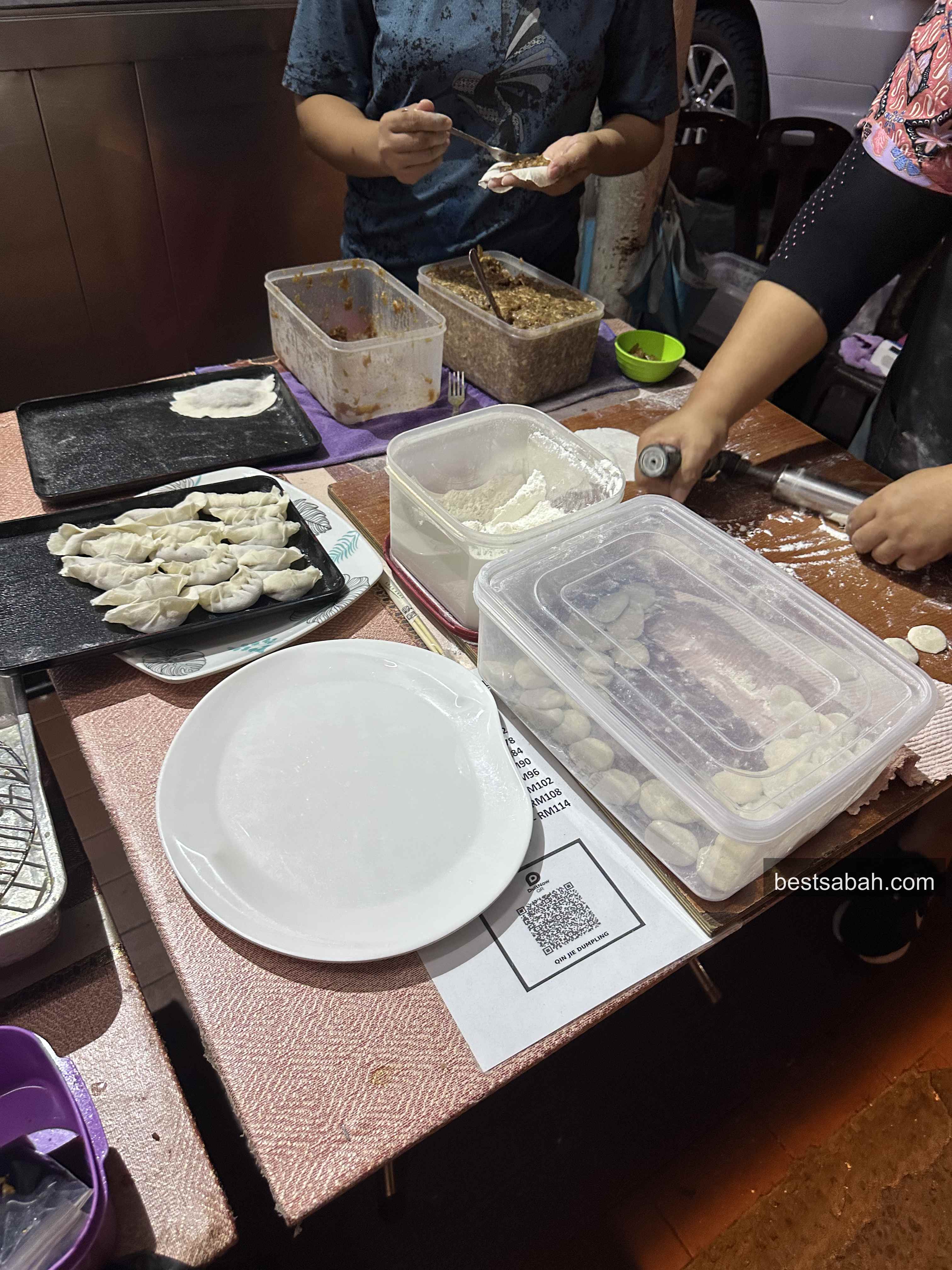 Dumplings being wrapped by hand at the Ching Jie cart inside Kai Shun, Foh Sang