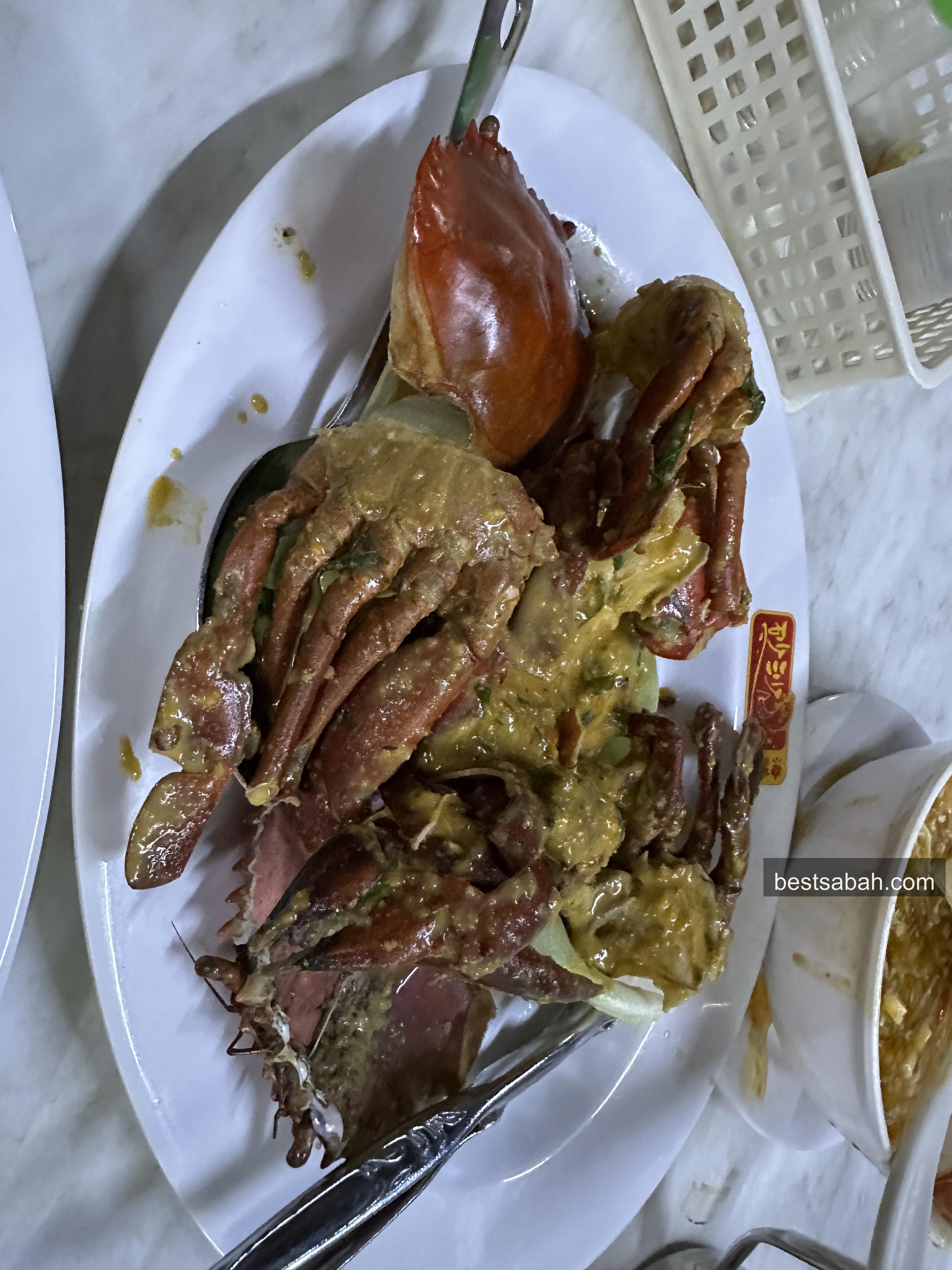 Salted egg crab at Sasa Seafood Restaurant Penampang, rich golden sauce coating fresh crab
