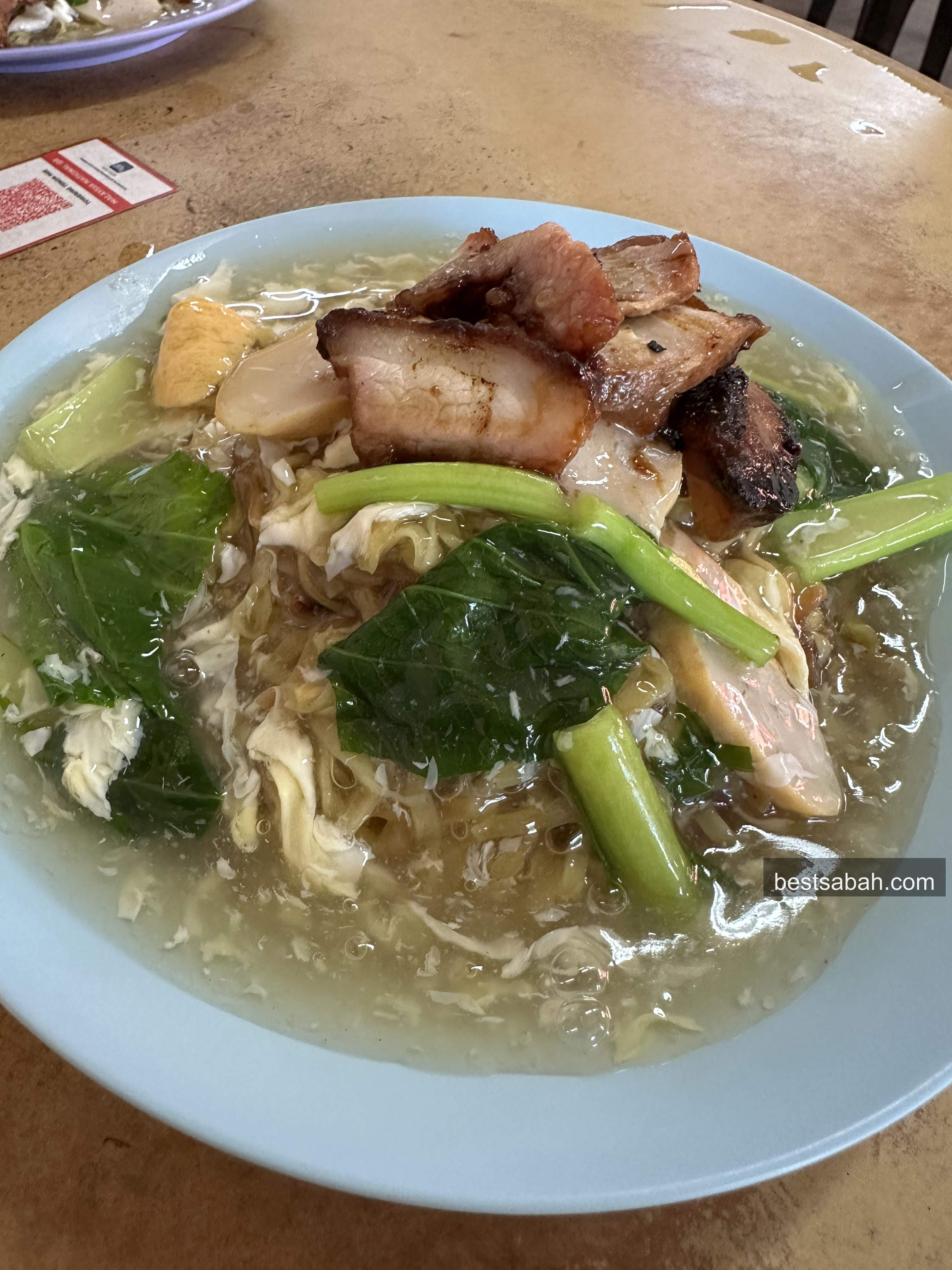 Plate of tenom mee in silky egg gravy with char siew at Towering Tenom Mee