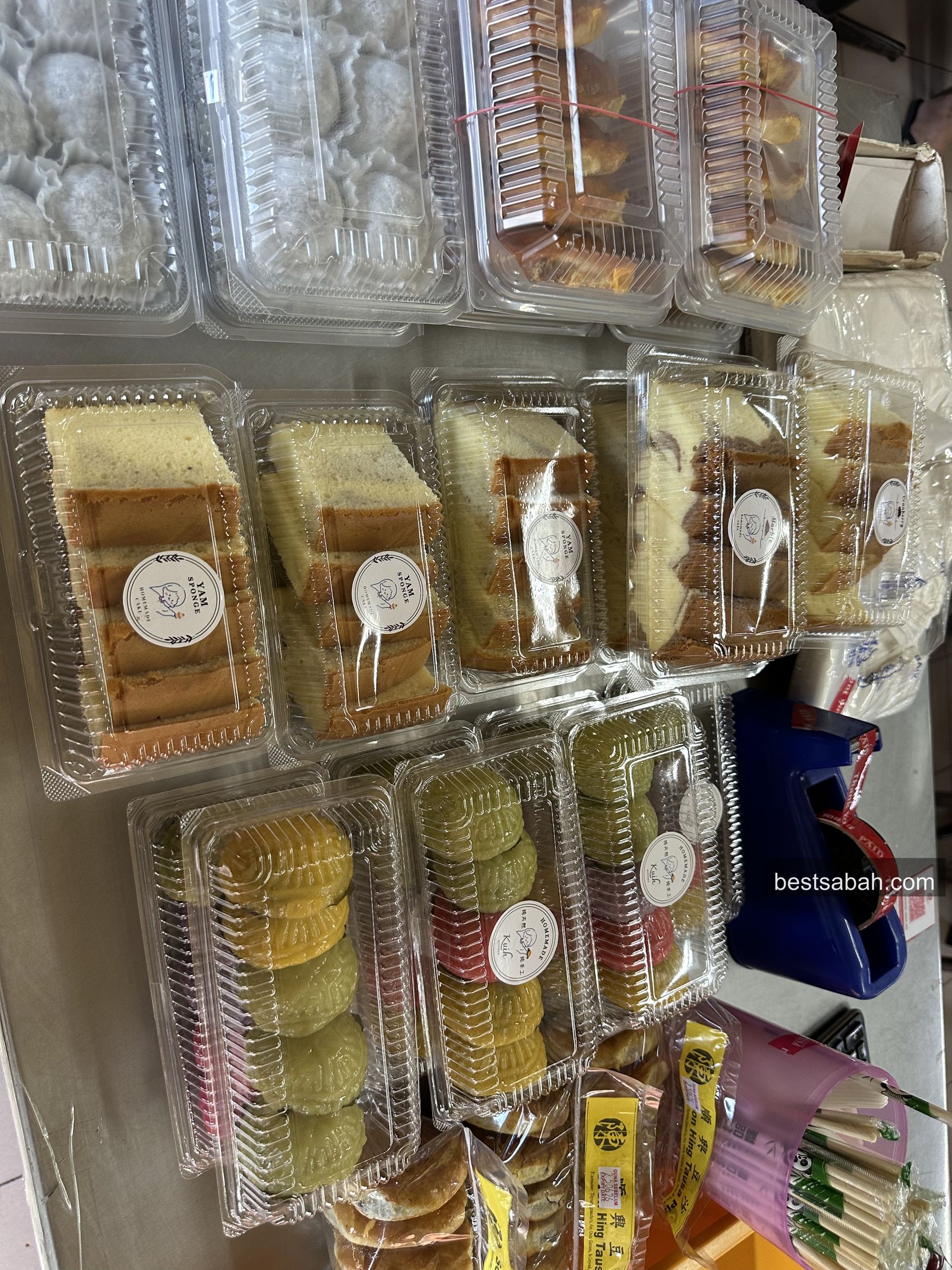 Boxes of kuih and sweet treats for sale at Towering Tenom Mee Kota Kinabalu