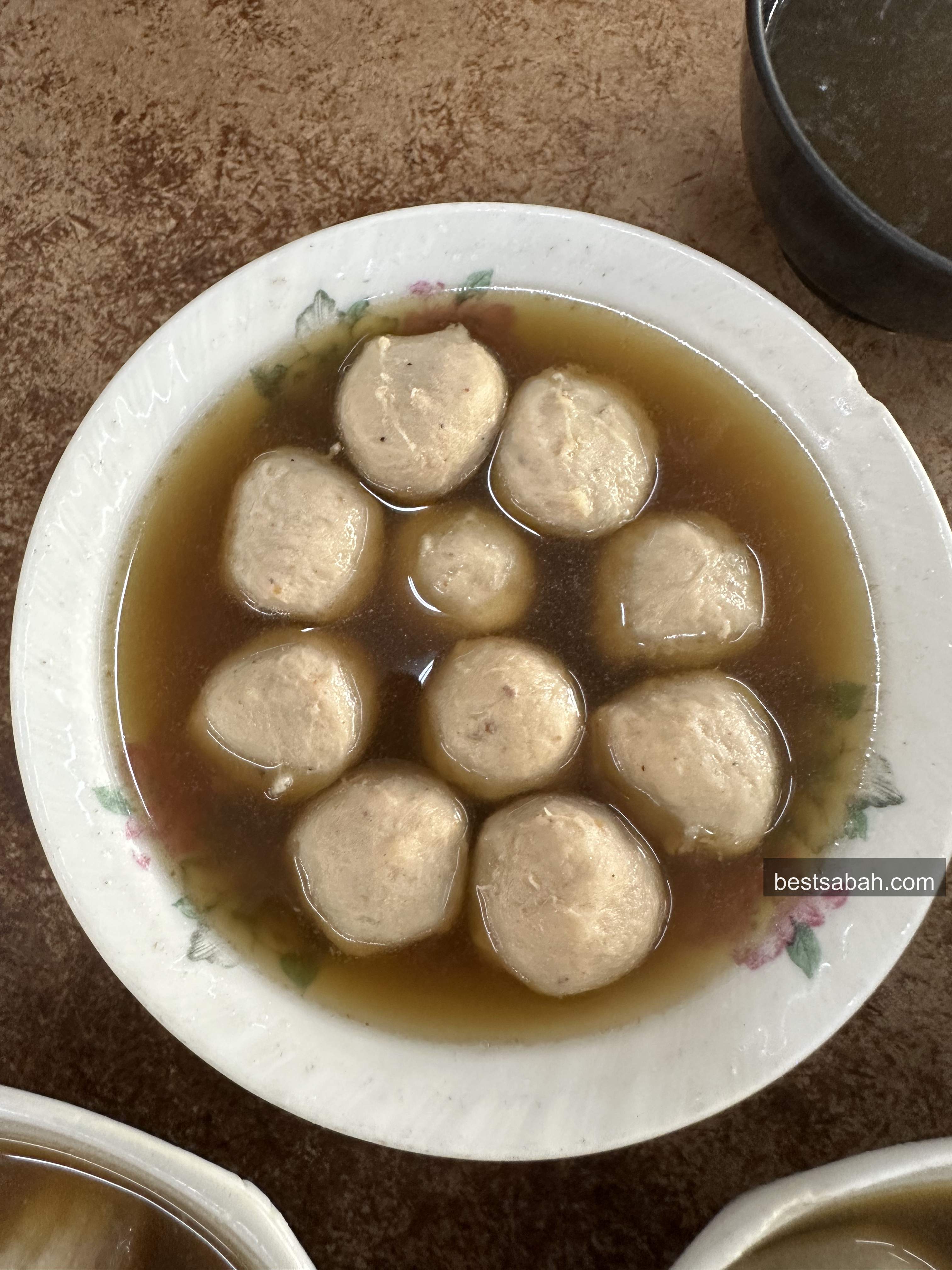 Meatballs soaking in Yu Kee bak kut teh broth